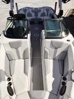 Slide: The Image of 2024 MasterCraft XT25 boat interior with sleek seating and modern design. - 11