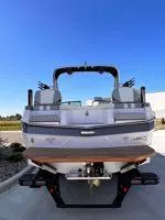 Slide: The Image of 2024 MasterCraft XT25 boat, rear view, showcasing sleek design and modern features. - 7