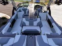 Slide: The Image of 2024 MasterCraft XT25 boat interior with modern seating and sleek design. - 8