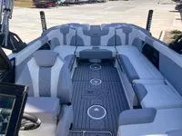 Slide: The Image of 2024 MasterCraft XT25 boat interior with spacious seating and modern design. - 9