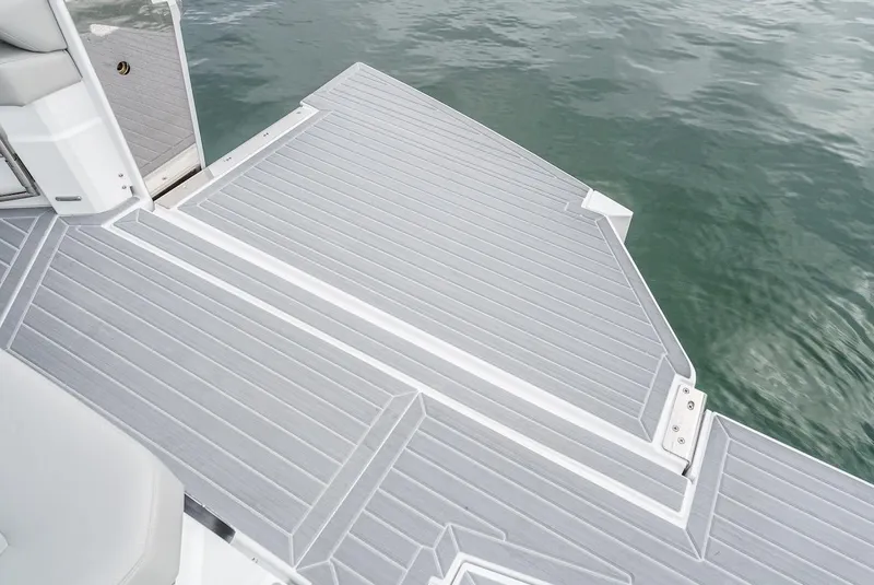 Slide: The Image of 2024 Cruisers Yachts 38 GLS OB swim platform on calm water. - 19