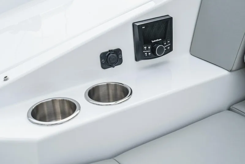 Slide: The Image of 2024 Cruisers Yachts 38 GLS OB interior with cup holders and control panel. - 26