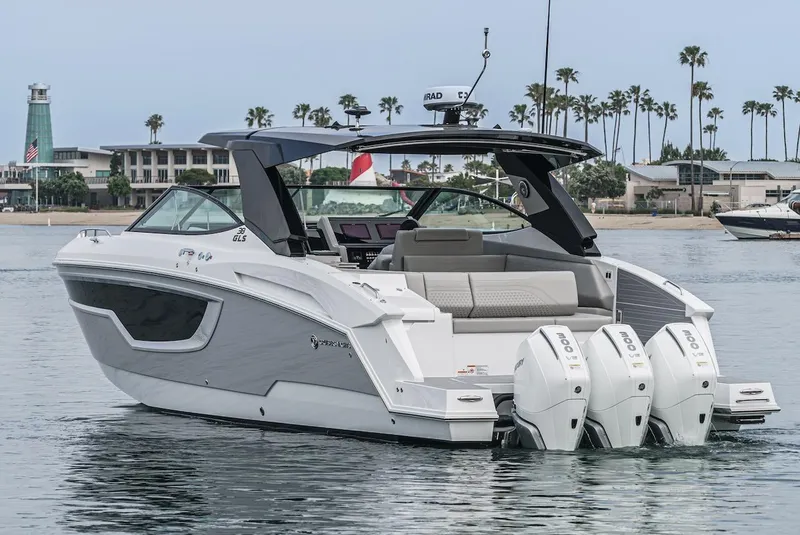 Slide: The Image of 2024 Cruisers Yachts 38 GLS OB in water, showcasing sleek design and triple outboard engines. - 5