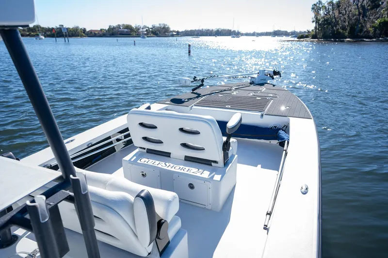 Slide: The Image of 2022 Young Boats 24 on serene water, featuring sleek design and comfortable seating. - 19