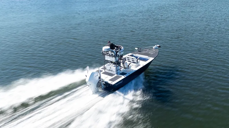 Slide: The Image of 2022 Young Boats 24 speeding on open water. - 3