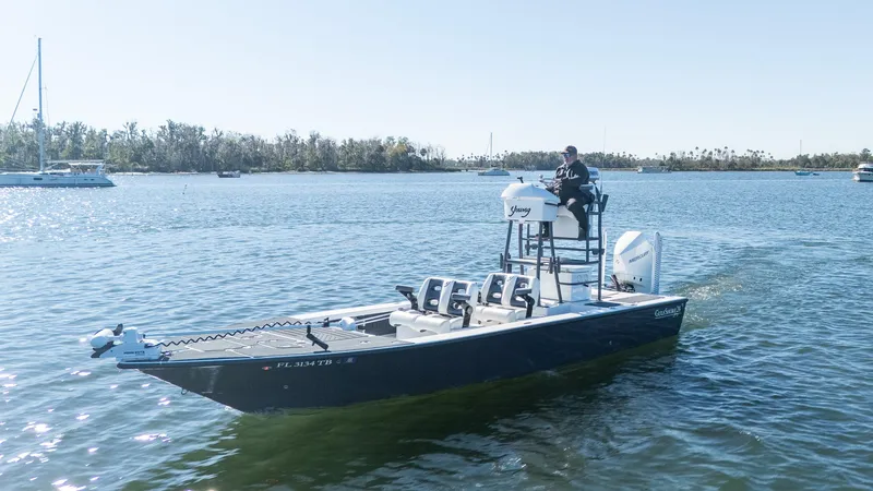 Slide: The Image of 2022 Young Boats 24 model on calm water, featuring sleek design and modern equipment. - 36