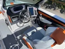Slide: The Image of 2024 MasterCraft X22 boat with Klipsch speakers and sleek design. - 11
