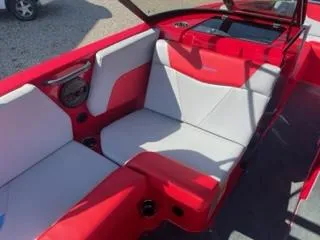 Slide: The Image of 2023 MasterCraft NXT 22 boat interior with red and white seating. - 6