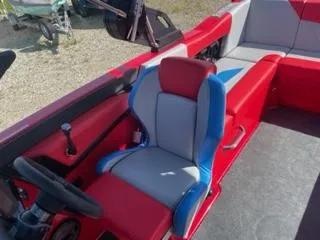 Slide: The Image of 2023 MasterCraft NXT 22 boat interior with red and gray seating. - 8