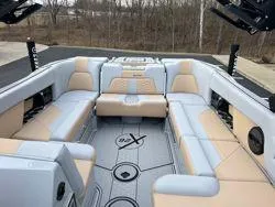Slide: The Image of 2024 MasterCraft X26 boat interior with luxurious seating and modern design. - 13