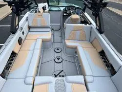 Slide: The Image of 2024 MasterCraft X26 boat interior with luxurious seating and modern design. - 7
