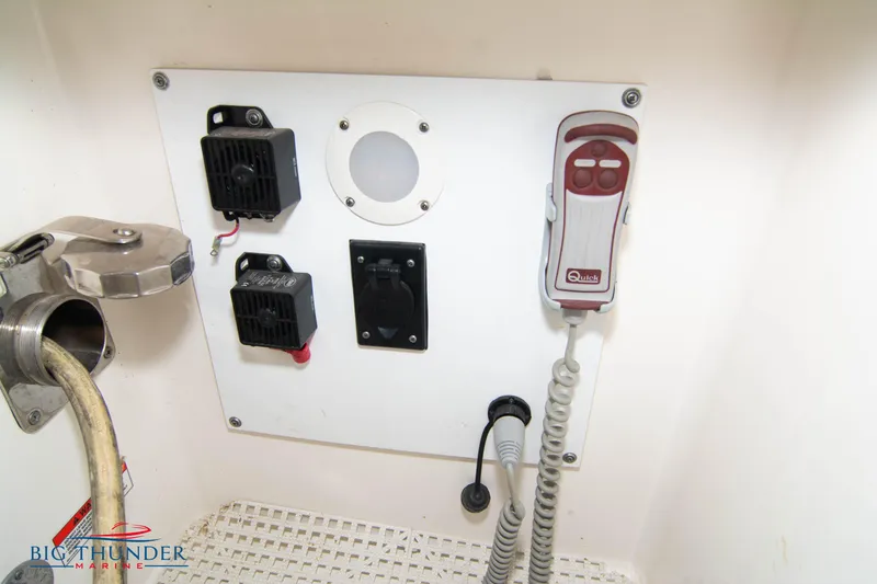 Slide: The Image of Control panel on 2013 Sea Ray 540 Sundancer boat with various switches and devices. - 11