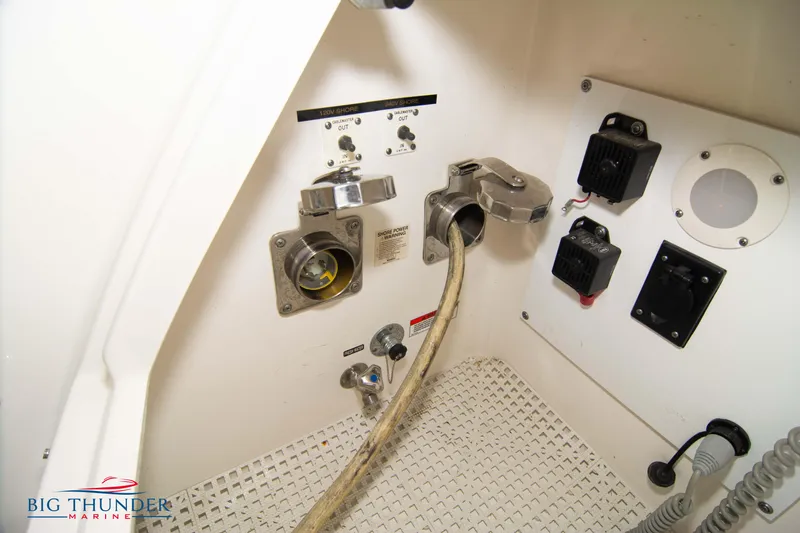 Slide: The Image of Sea Ray 540 Sundancer 2013 electrical panel with cables and controls. - 12