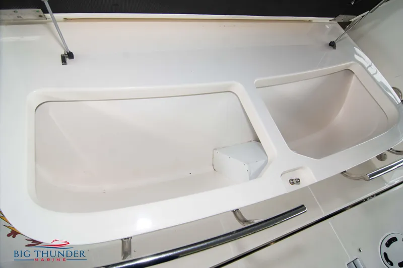 Slide: The Image of 2013 Sea Ray 540 Sundancer boat storage compartments with sleek design. - 13