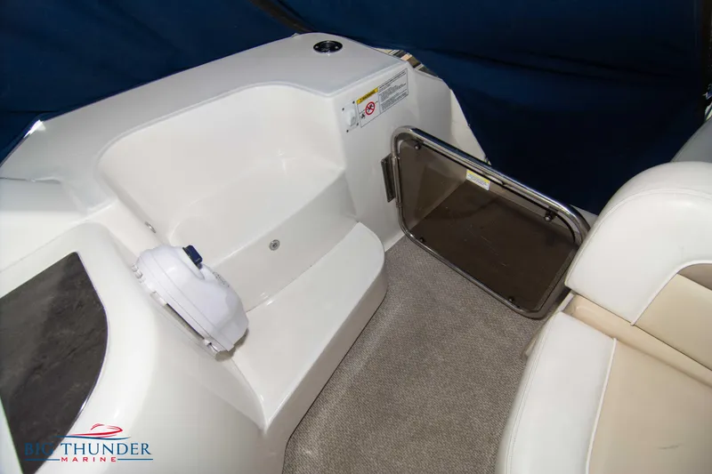 Slide: The Image of Interior seating area of 2013 Sea Ray 540 Sundancer yacht with carpeted flooring. - 20