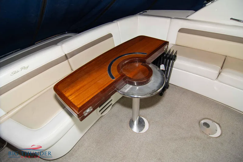 Slide: The Image of 2013 Sea Ray 540 Sundancer interior with elegant wooden table and seating. - 22