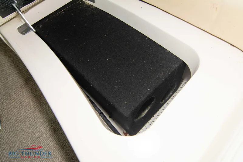 Slide: The Image of Sea Ray 540 Sundancer 2013 boat component, black cover on white surface. - 24