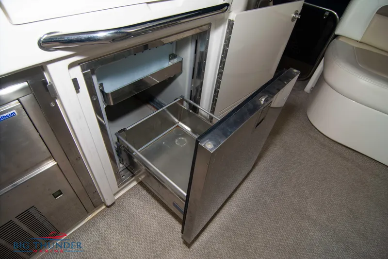 Slide: The Image of Open stainless steel drawer in 2013 Sea Ray 540 Sundancer yacht interior. - 29