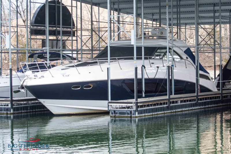 Slide: The Image of 2013 Sea Ray 540 Sundancer yacht docked in marina. - 3