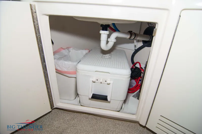 Slide: The Image of Under-sink storage on 2013 Sea Ray 540 Sundancer yacht, featuring plumbing and equipment. - 31