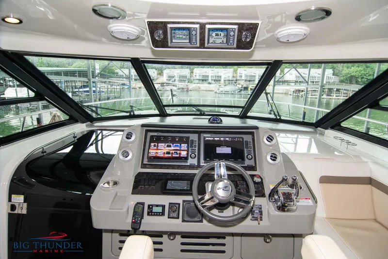 Slide: The Image of Helm of 2013 Sea Ray 540 Sundancer with advanced navigation systems. - 38