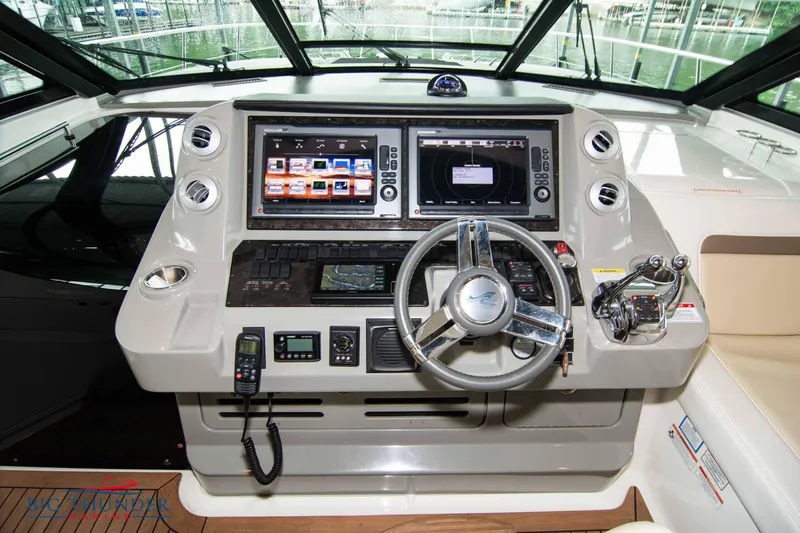 Slide: The Image of Cockpit of 2013 Sea Ray 540 Sundancer with advanced navigation systems and controls. - 39