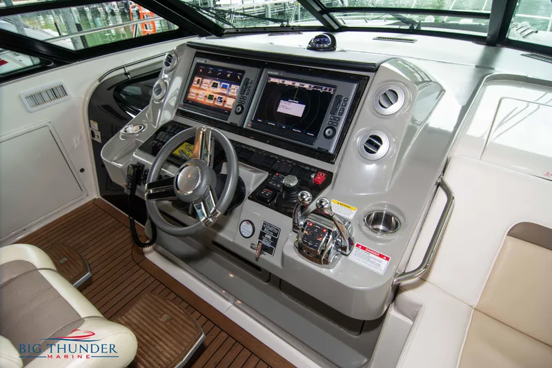Slide: The Image of 2013 Sea Ray 540 Sundancer helm with advanced navigation controls and displays. - 41