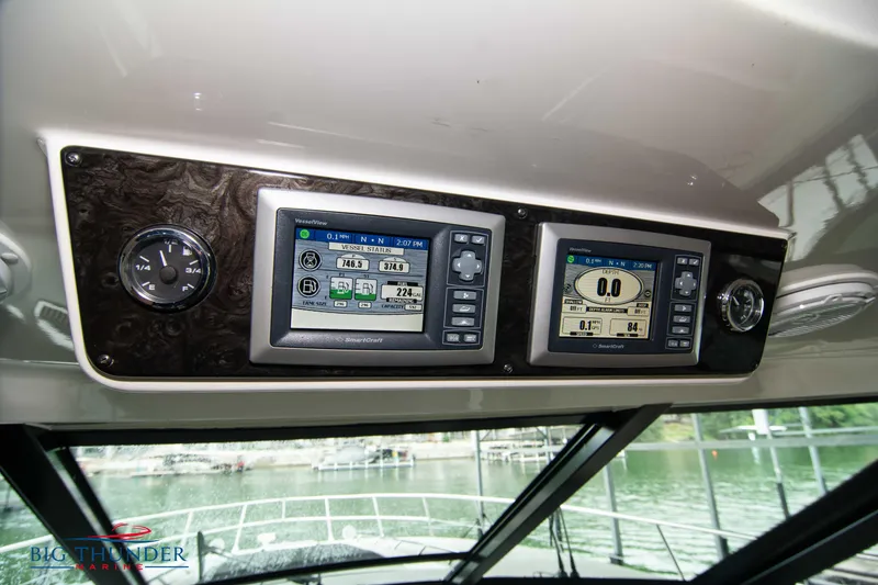 Slide: The Image of 2013 Sea Ray 540 Sundancer dashboard with navigation displays and controls. - 45