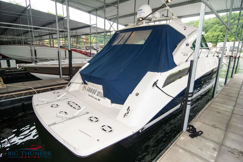 Slide: The Image of 2013 Sea Ray 540 Sundancer yacht docked under a covered marina. - 5