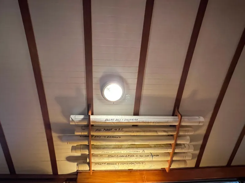 Slide: The Image of Ceiling of 1972 Grand Banks 42 Classic with stored navigation charts. - 14