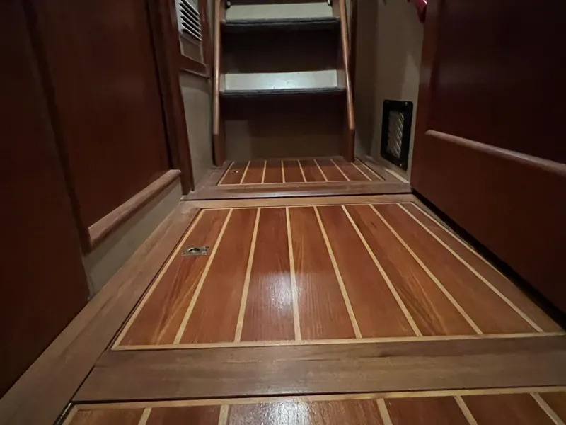 Slide: The Image of Wooden interior flooring and stairs of a 1972 Grand Banks 42 Classic yacht. - 18