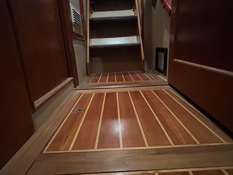 Slide: The Image of Wooden interior flooring and stairs of a 1972 Grand Banks 42 Classic boat. - 21