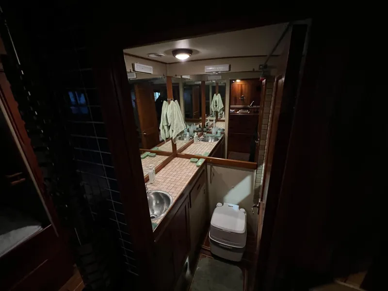 Slide: The Image of Interior of 1972 Grand Banks 42 Classic yacht bathroom with sink and mirror. - 25