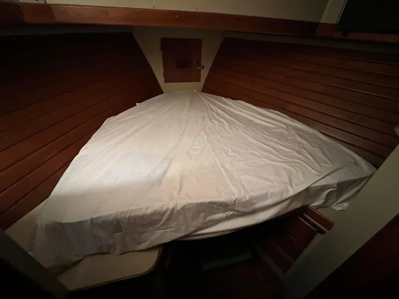Slide: The Image of Cozy cabin bed in 1972 Grand Banks 42 Classic yacht with wooden paneling. - 31