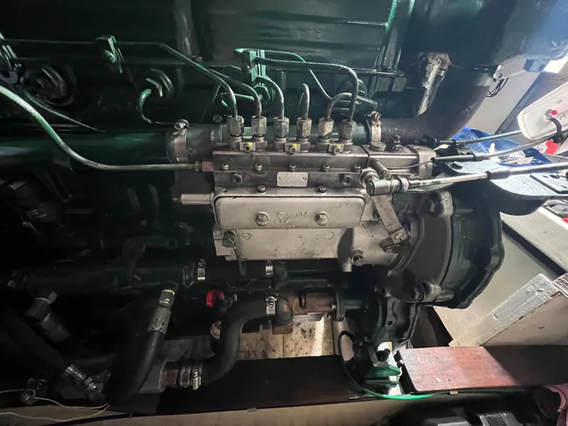 Slide: The Image of Engine of a 1972 Grand Banks 42 Classic boat, showcasing intricate mechanical components. - 33