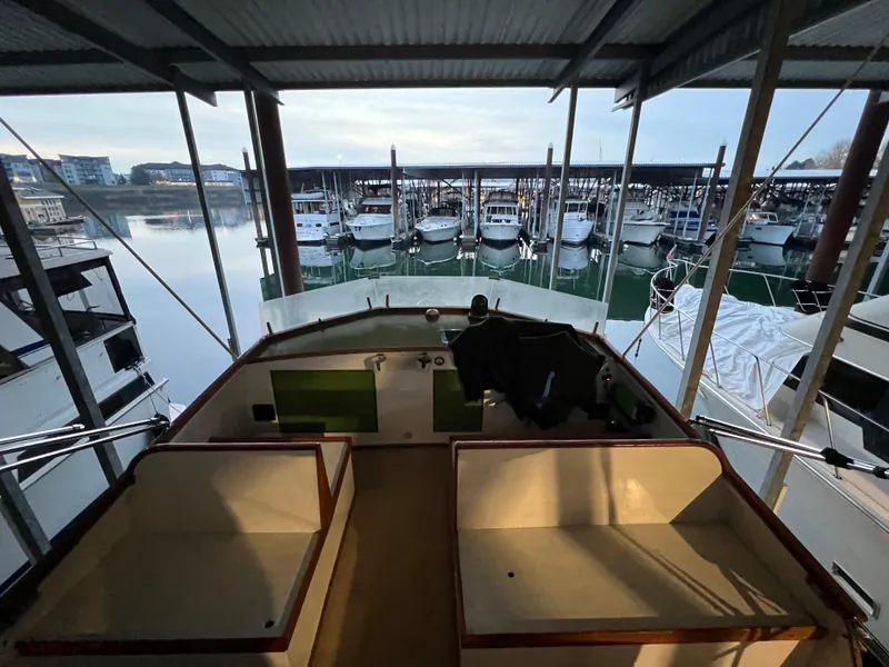 Slide: The Image of 1972 Grand Banks 42 Classic yacht docked in a marina, surrounded by other boats. - 35