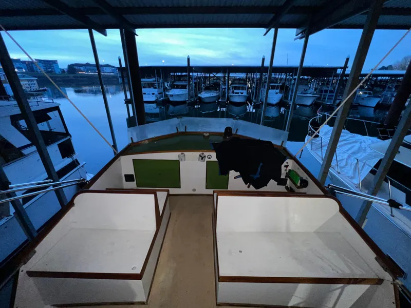 Slide: The Image of 1972 Grand Banks 42 Classic boat interior at marina during twilight. - 36