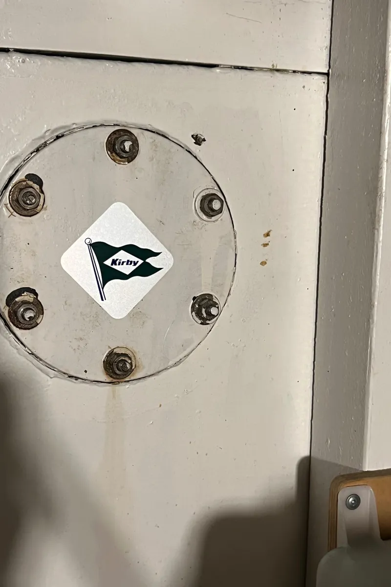 Slide: The Image of 1972 Grand Banks 42 Classic boat detail with a flag sticker on a metal plate. - 43