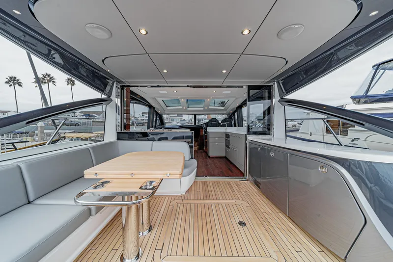 Slide: The Image of Luxurious 2025 Princess V55 yacht interior with sleek design and spacious seating area. - 10