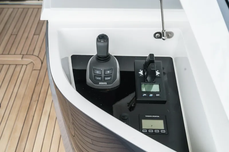 Slide: The Image of Control panel of 2025 Princess V55 yacht with joystick and digital display. - 16