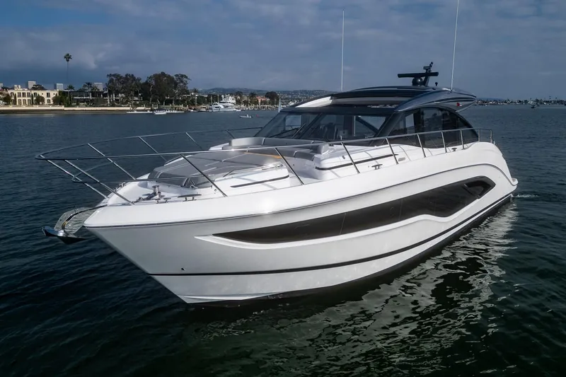 Slide: The Image of 2025 Princess V55 luxury yacht cruising on calm waters. - 2