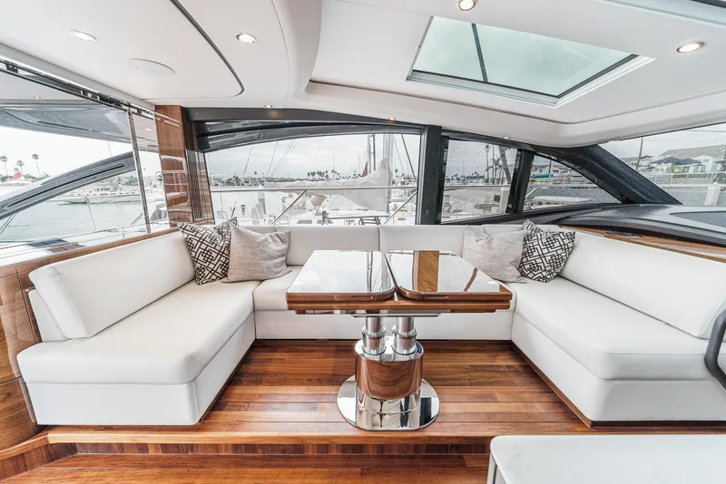 Slide: The Image of Luxurious interior of 2025 Princess V55 yacht with white seating and wooden accents. - 25
