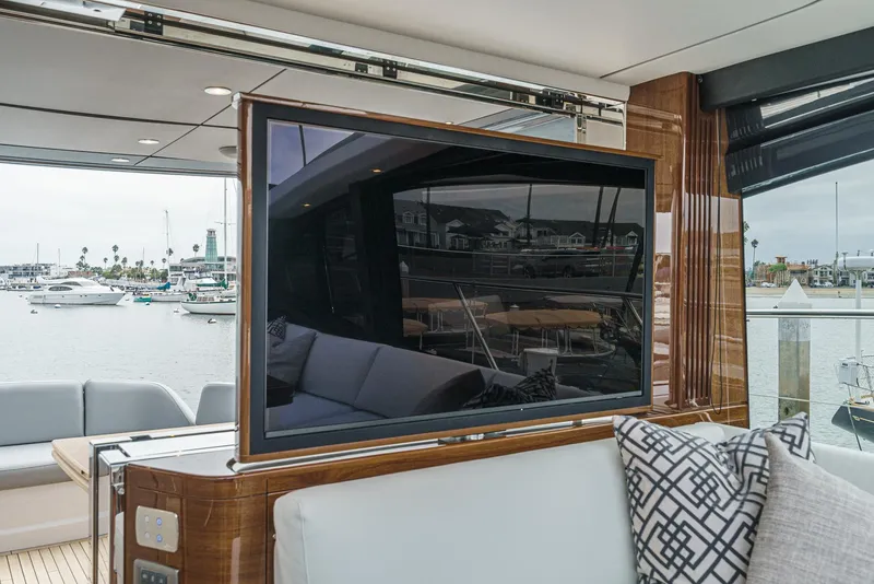 Slide: The Image of Luxury interior of 2025 Princess V55 yacht with TV and marina view. - 28