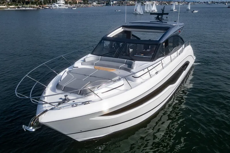 Slide: The Image of 2025 Princess V55 luxury yacht cruising on a serene waterway. - 3