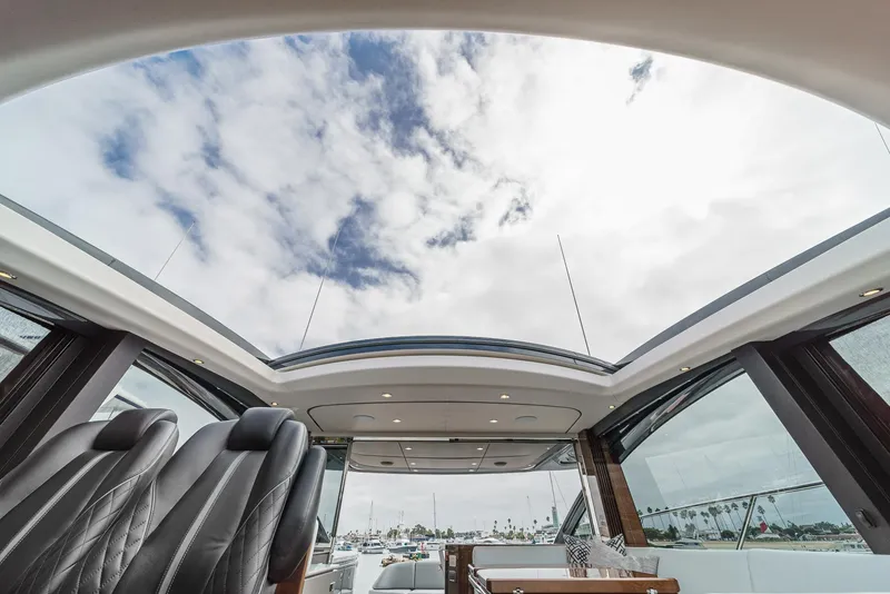 Slide: The Image of Interior view of 2025 Princess V55 yacht with panoramic sunroof and luxurious seating. - 30