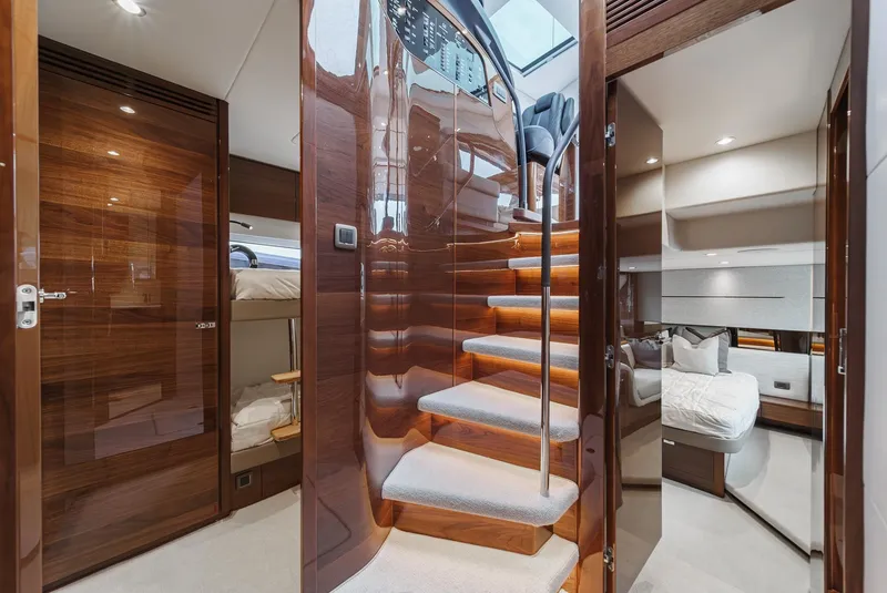 Slide: The Image of Luxurious interior of 2025 Princess V55 yacht with elegant wooden finishes and modern design. - 36