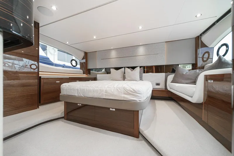 Slide: The Image of Luxurious interior of 2025 Princess V55 yacht with elegant wood finishes and modern design. - 37