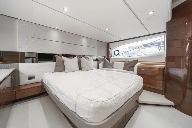 Slide: The Image of Luxurious interior of 2025 Princess V55 yacht with elegant bedding and modern design. - 38