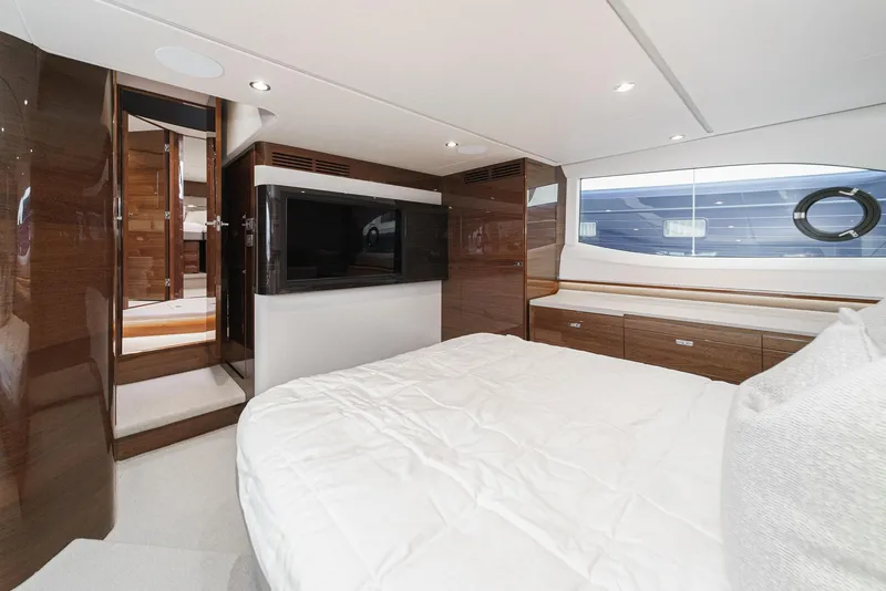 Slide: The Image of Luxurious interior of 2025 Princess V55 yacht bedroom with modern design. - 39
