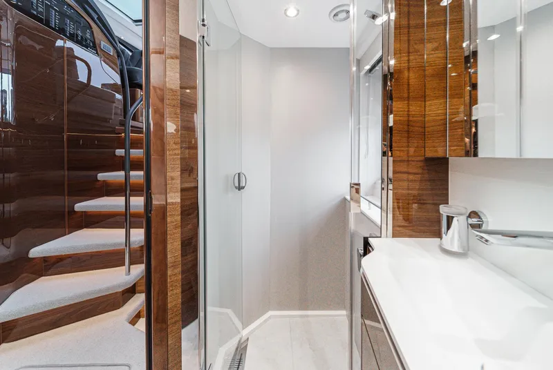Slide: The Image of Luxurious bathroom interior of 2025 Princess V55 yacht with modern design and wooden accents. - 45